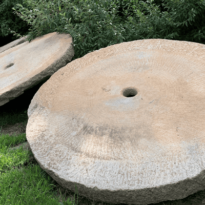 7 foot antique millstones in the Stone Farm yard