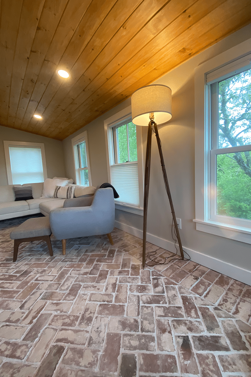 Reclaimed brick floor tile herringbone living room