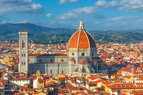 photo of Il Duomo, in Florence Italy.  The Dome is made with vibrant red bricks.