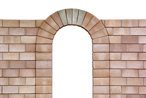 Photo of a voissured arch, with wedge shaped building bricks used to complete the top of the arch.