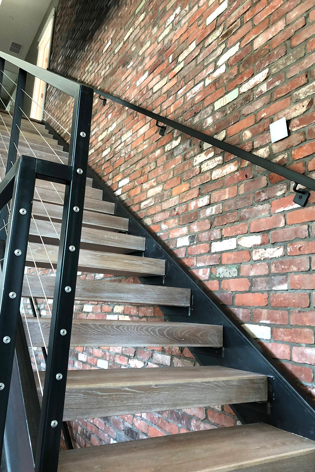 Reclaimed Thin Brick Loft Wall by Stairs