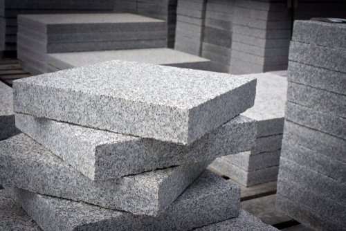 A photo of New England granite squares, freshly quarried.