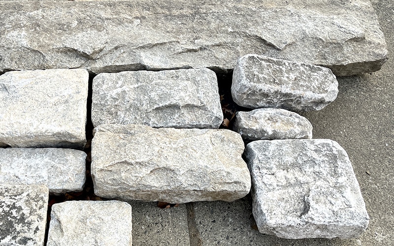 Reclaimed full bed stone veneer mock-up in the Stone Farm yard, including curbing.