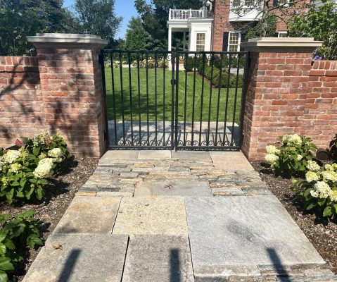 Reclaimed brick property fence and gate posts.