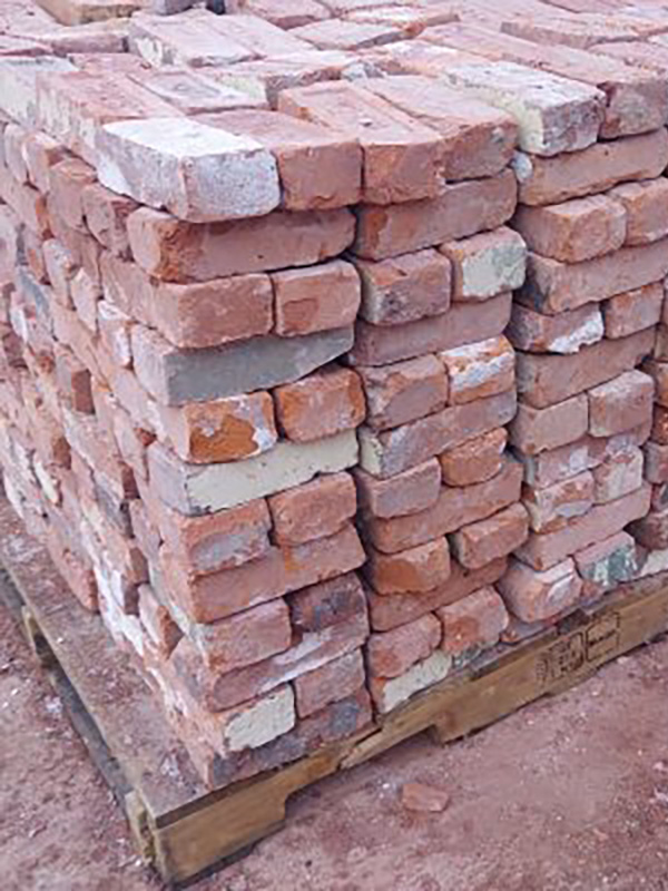 Reclaimed brick from a New England mill stacked on a pallet.