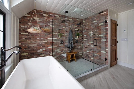 Reclaimed brick veneer shower wall