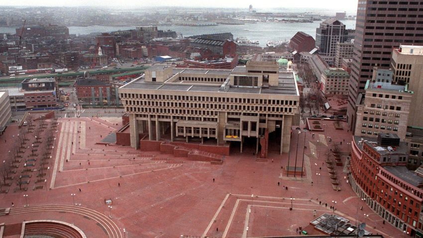 A bird's-eye view of Boston City Plaza's red brick pavers, with Boston Bay in the background.