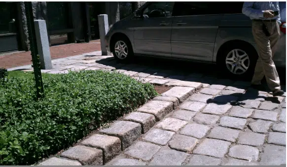 Jumbo cobblestones, with a car parked in the background