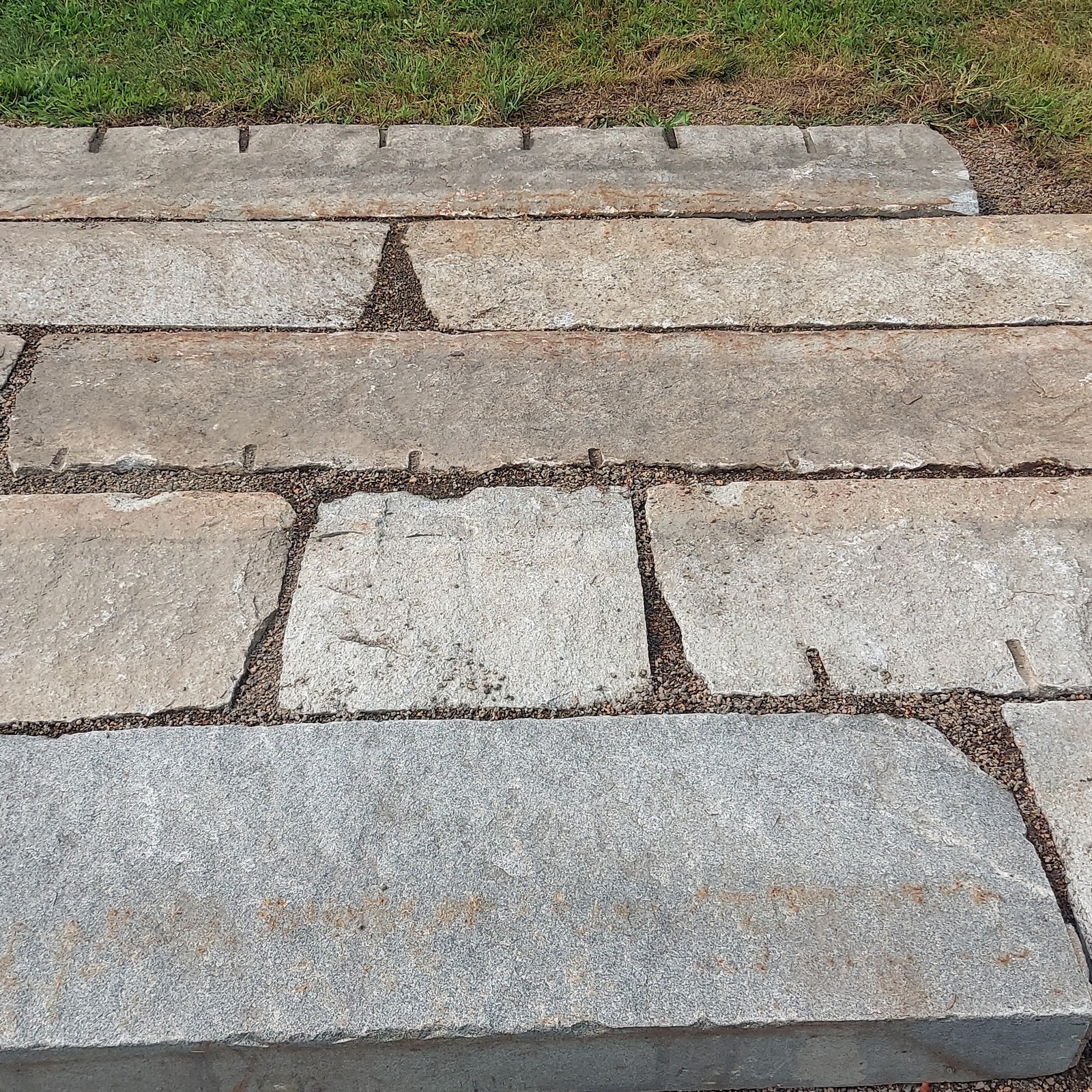 a mockup of paving-grade reclaimed granite curbing pieces