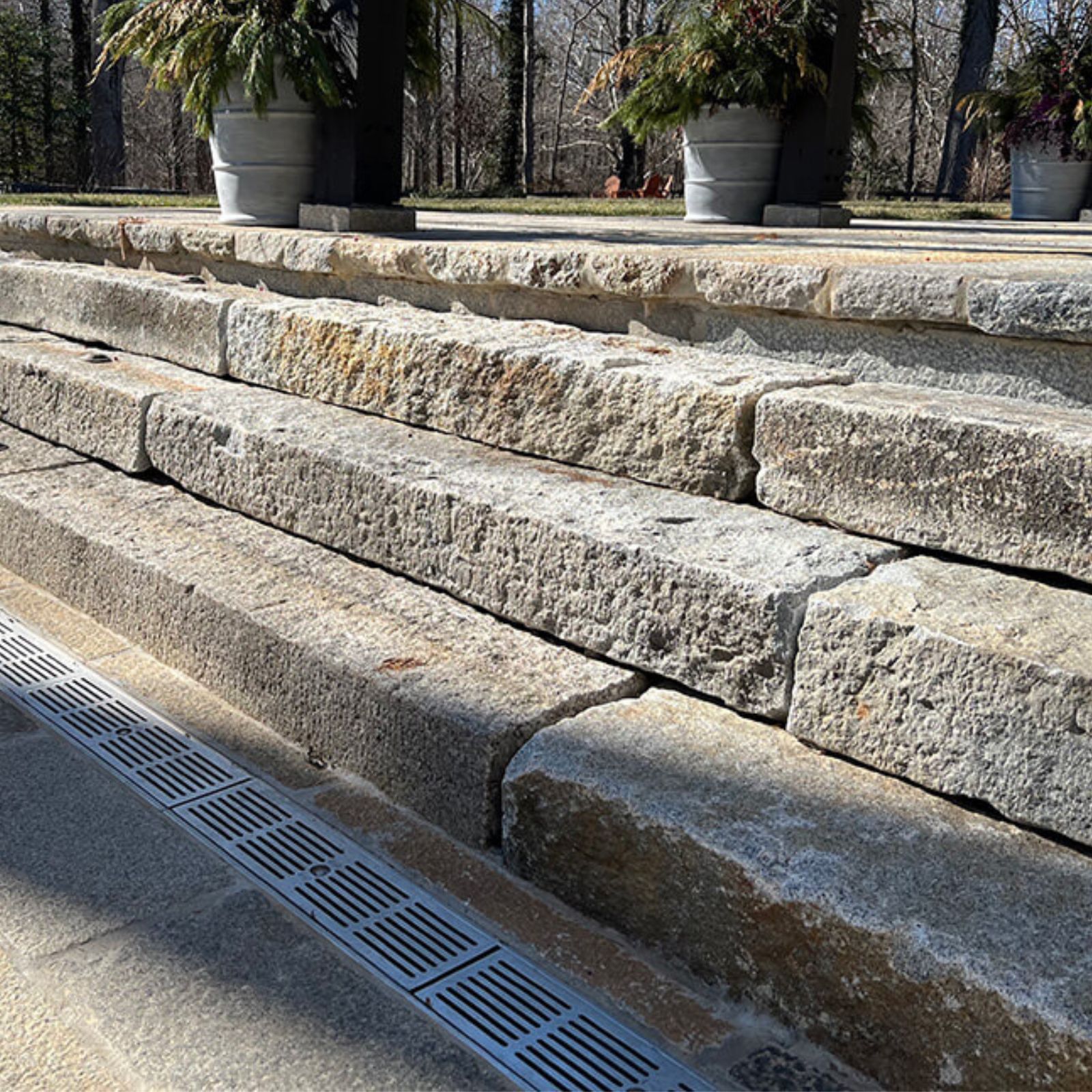 reclaimed granite curbing used for steps leading up to a patio
