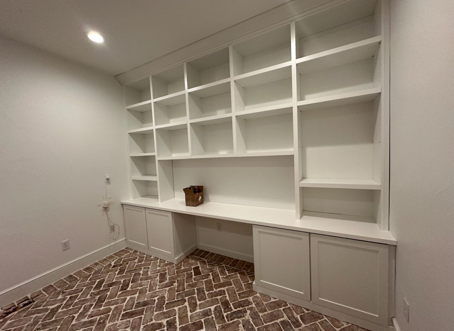 Office space with reclaimed brick floor.